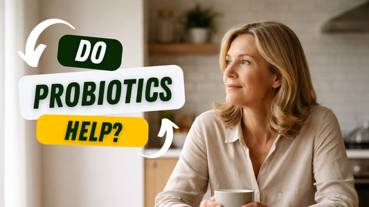 Woman in her 50s sitting at kitchen table with coffee looking thoughtful representing gut-brain health connection